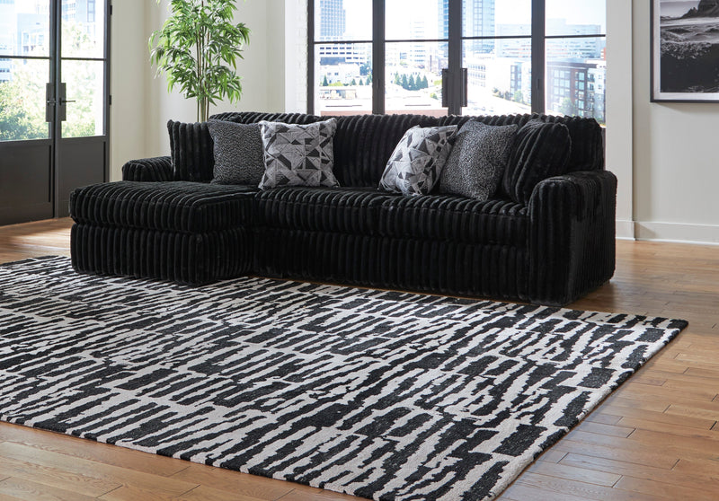 Midnight-Madness Onyx LAF Chase Sectional and Ottoman from Ashley - Lara Furniture