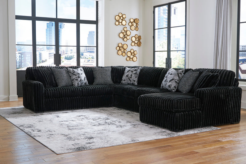 Midnight-Madness 4-Piece Sectional with Ottoman in Onyx from Ashley - Lara Furniture