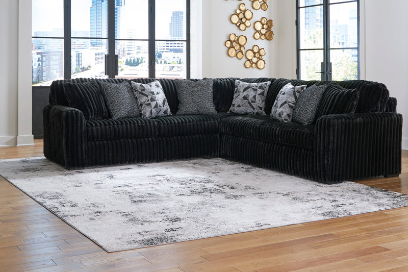 Midnight-Madness 3-Piece Sectional with Ottoman in Onyx from Ashley - Lara Furniture