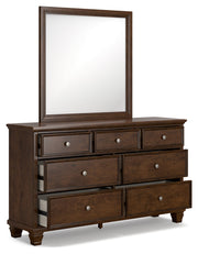 Danabr Brown King Panel Bed with Mirrored Dresser from Ashley - Lara Furniture