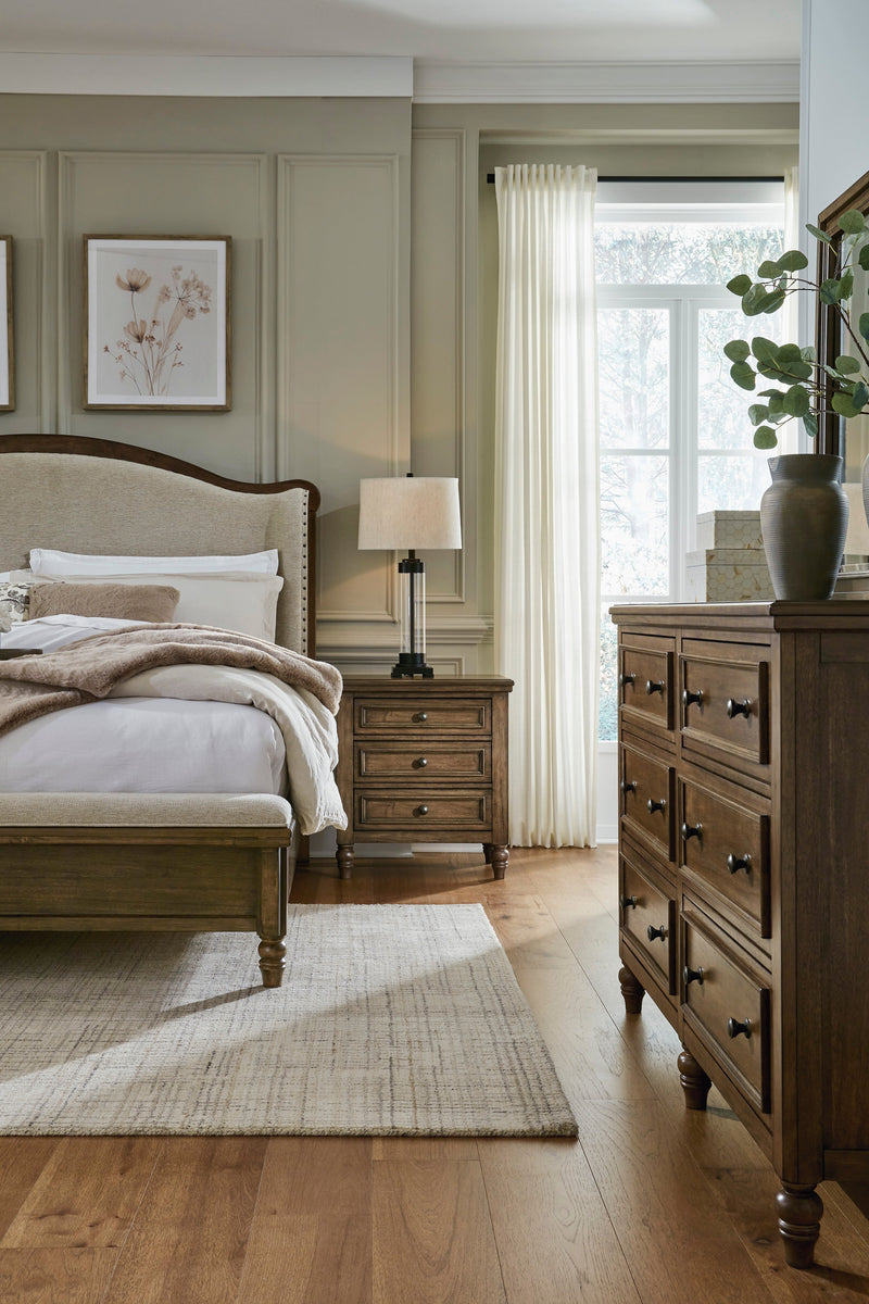 Sturlayne Brown California King Upholstered Panel Bed from Ashley - Lara Furniture