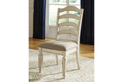 Realyn Chipped White Oval Dining Table and 4 Ladder Back Chairs from Ashley - Lara Furniture