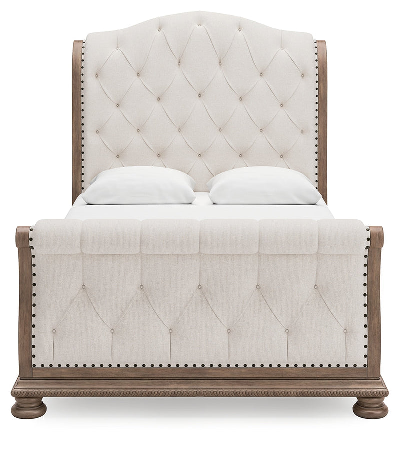 Ardenfield Queen Upholstered Sleigh Bed with Dresser in Light Brown from Ashley - Lara Furniture