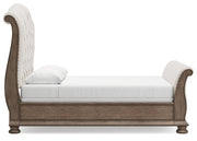 Ardenfield Queen Upholstered Sleigh Bed with Mirrored Dresser in Light Brown from Ashley - Lara Furniture