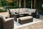 Brook Ranch Outdoor Sectional Set with Lounge Chair and Coffee Table in Brown from Ashley - Lara Furniture