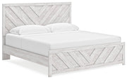 Cayboni King Panel Bed with Mirrored Dresser, Chest and Nightstand in Whitewash from Ashley - Lara Furniture