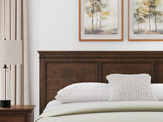 Danabrin King Panel Storage Bed, Dresser and Nightstand in Brown - PKG023945