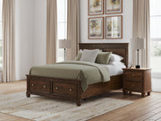 Danabrin Queen Panel Storage Bed, Dresser, Mirror and Nightstand in Brown - PKG023939