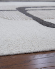 Davismour Ivory/Taupe/Charcoal 7'8" x 10' Area Rug - R407561