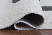 Davismour Ivory/Taupe/Charcoal 7'8" x 10' Area Rug - R407561