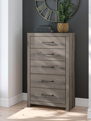 Graystorm King Panel Bed, Dresser, Mirror, Chest and 2 Nightstands in Brown Gray - PKG021357