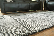 Kurtmen Black/Ivory 5' x 7' Area Rug - R407592