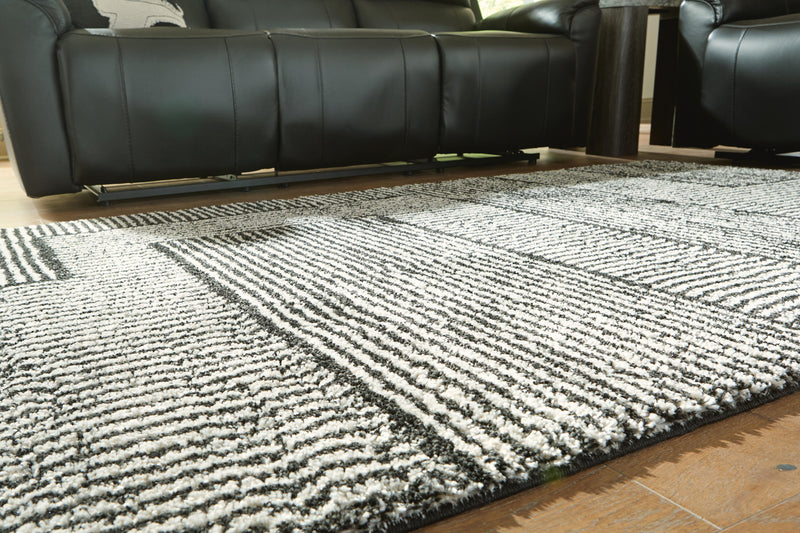 Kurtmen Black/Ivory 7'10" x 9'10" Area Rug - R407591