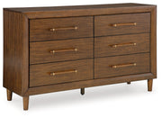 Lyncott California King Upholstered Bed with Dresser and 2 Nightstands in Brown from Ashley - Lara Furniture