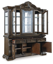 Maylee Dining Table and 8 Chairs with Storage in Dark Brown from Ashley - Lara Furniture