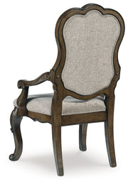 Maylee Dining Table and 8 Chairs with Storage in Dark Brown from Ashley - Lara Furniture