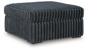 Midnight-Madness 4-Piece Sectional and Ottoman - 98105U5