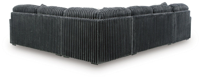 Midnight-Madness 4-Piece Sectional and Ottoman - 98105U5