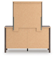 Pamytta King Upholstered Panel Platform Bed, Dresser, Mirror and Chest in Brown - PKG022749