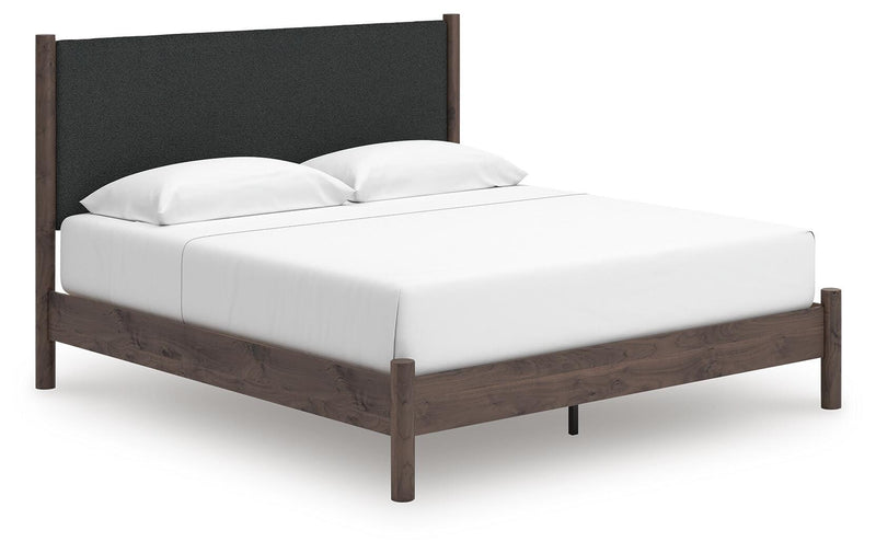 Pamytta King Upholstered Panel Platform Bed, Dresser, Mirror and Nightstand in Brown - PKG022748