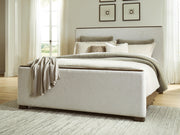 Radkin Burnished Brown King Upholstered Panel Bed - PCB843B4