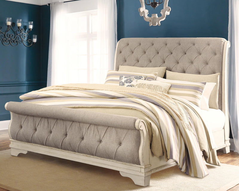 Realyn California King Sleigh Bed with Mirrored Dresser and Chest in Chipped White - PKG006652