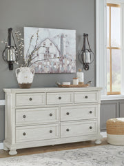 Robbinsdale California King Sleigh Bed with Storage with Mirrored Dresser in Antique White from Ashley - Lara Furniture