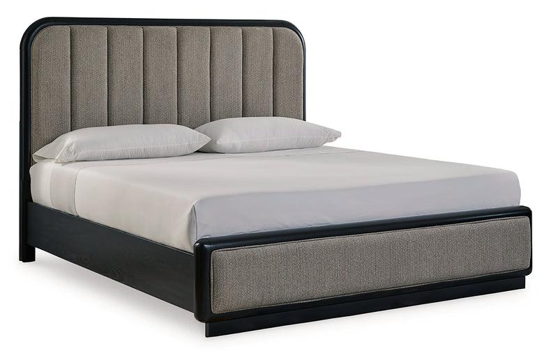 Rowanbeck California King Upholstered Panel Bed with Mirrored Dresser and Nightstand in Gray/Black from Ashley - Lara Furniture