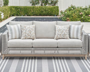 Seton Creek Outdoor Sofa and Loveseat with Coffee Table in Gray from Ashley - Lara Furniture