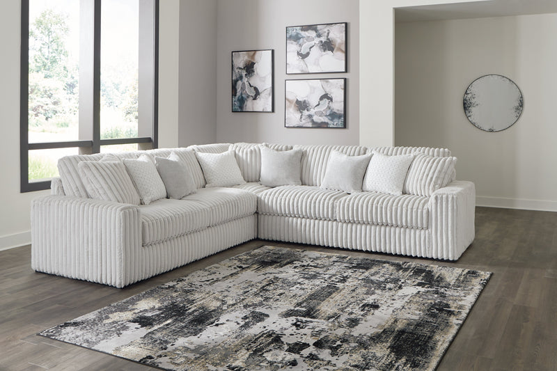 Stupendous Alloy 3-Piece Sectional with Ottoman from Ashley - Lara Furniture
