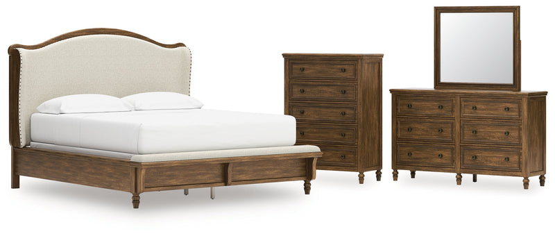 Sturlayne California King Upholstered Panel Bed with Mirrored Dresser and Chest in Brown from Ashley - Lara Furniture