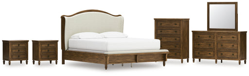 Sturlayne California King Upholstered Panel Bed with Mirrored Dresser, Chest and 2 Nightstands in Brown from Ashley - Lara Furniture