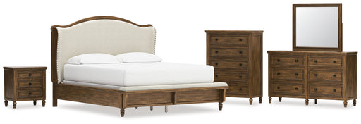 Sturlayne California King Upholstered Panel Bed with Mirrored Dresser, Chest and Nightstand in Brown from Ashley - Lara Furniture