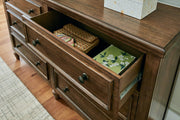 Sturlayne King Upholstered Panel Bed with Dresser and 2 Nightstands in Brown from Ashley - Lara Furniture