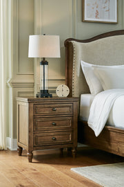 Sturlayne King Upholstered Panel Bed with Dresser and 2 Nightstands in Brown from Ashley - Lara Furniture