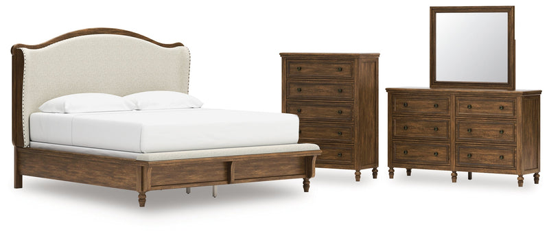 Sturlayne King Upholstered Panel Bed with Mirrored Dresser and Chest in Brown from Ashley - Lara Furniture