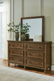 Sturlayne King Upholstered Panel Bed with Mirrored Dresser and Nightstand in Brown from Ashley - Lara Furniture