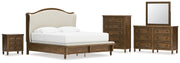 Sturlayne King Upholstered Panel Bed with Mirrored Dresser, Chest and Nightstand in Brown from Ashley - Lara Furniture