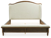 Sturlayne Queen Upholstered Panel Bed with Mirrored Dresser and Chest in Brown from Ashley - Lara Furniture