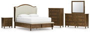 Sturlayne Queen Upholstered Panel Bed with Mirrored Dresser, Chest and Nightstand in Brown from Ashley - Lara Furniture