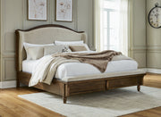 Sturlayne Queen Upholstered Panel Bed with Mirrored Dresser, Chest and Nightstand in Brown from Ashley - Lara Furniture