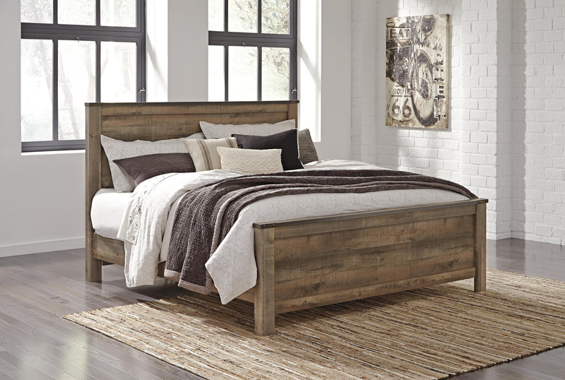 Trinell Brown King Panel Bed. Dresser, Mirror, Chest and 2 Nightstands - B446B97