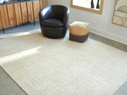 Wolbert Tan/Ivory 7'8" x 10' Area Rug - R407661