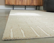 Wolbert Tan/Ivory 7'8" x 10' Area Rug - R407661