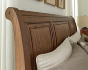 Zackaryn Warm Brown California King Sleigh Storage Bed - PCB807B9