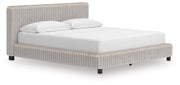 Zuraleus California King Upholstered Bed, Dresser, Mirror and Nightstand in White - PKG022858
