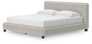 Zuraleus King Upholstered Bed, Dresser, Mirror, Chest and Nightstand in White - PKG022852