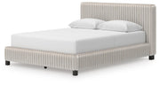 Zuraleus Queen Upholstered Bed, Dresser and Nightstand in White - PKG022846