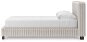 Zuraleus Queen Upholstered Bed, Dresser, Mirror, Chest and Nightstand in White - PKG022844