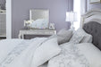Coralayne Silver Upholstered Queen Panel Bed - Lara Furniture